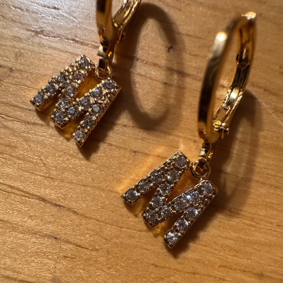 Gold Tone Huggie Rhinestone M Earrings - Picture 2 of 5